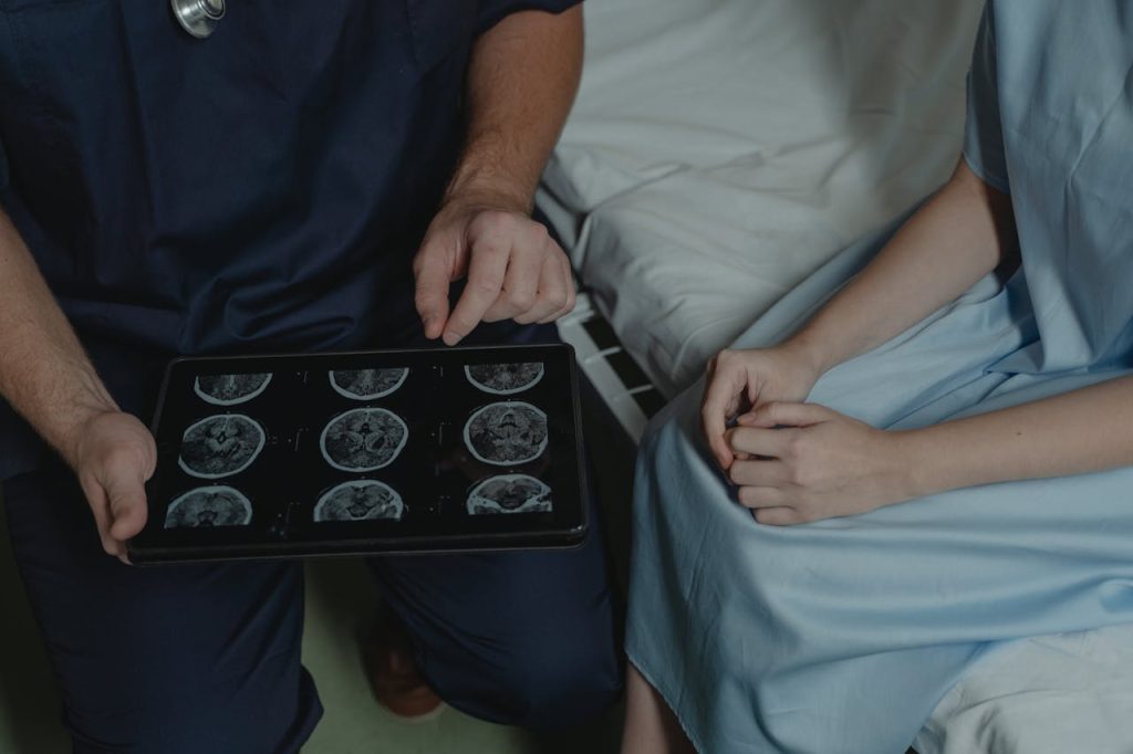 Crafting Captivating Headlines: Your awesome post title goes here A doctor shows and explains brain scan images to a patient in a medical setting.